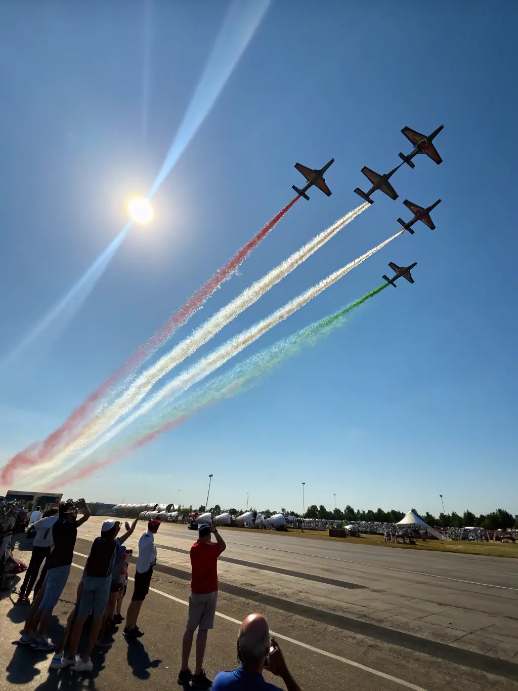 A captivating image of a vintage aircraft soaring through the sky during an ASS-AEROECHOKILO airshow, with spectators watching in awe, capturing the excitement of aviation events.